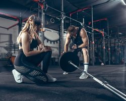 athletic-man-woman-with-dumbbells